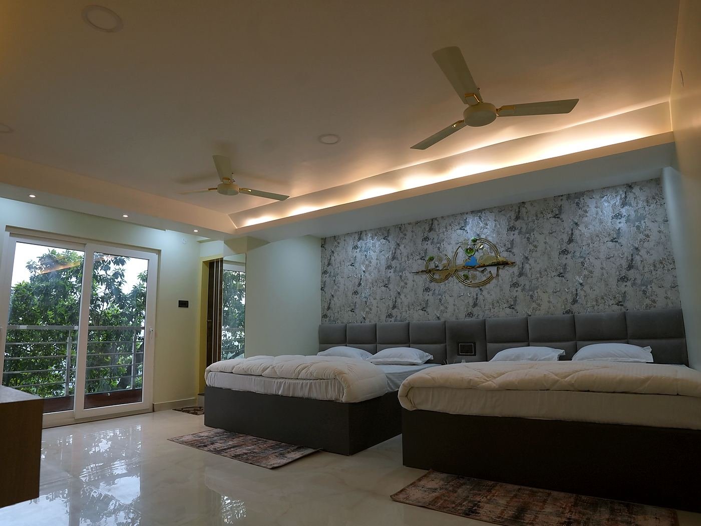 Family Room — two large beds in a bright room with wide windows